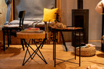 A living room filled with furniture and a fire place
