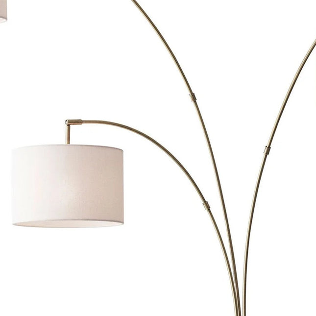 74" Brass Three Light Arc Floor Lamp With Off White Fabric Drum Shade HomeRoots