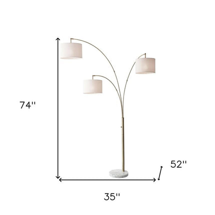 74" Brass Three Light Arc Floor Lamp With Off White Fabric Drum Shade HomeRoots