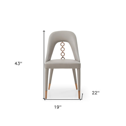 Set of Two Light Gray Faux Leather Dining Side Chairs With Rose Gold Accents HomeRoots