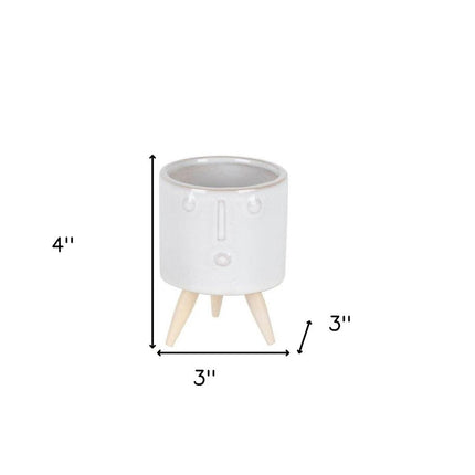 Set of Three White Porcelain 1 Ounce Round Funny Face Pot Planters With Stands HomeRoots