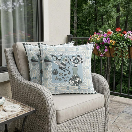 Set of Two Light Blue Black And Cream Peacock Indoor Outdoor Throw Pillow