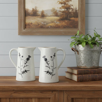 Set of Two Black And Off White Floral Ceramic Cylinder Pitcher Vase HomeRoots